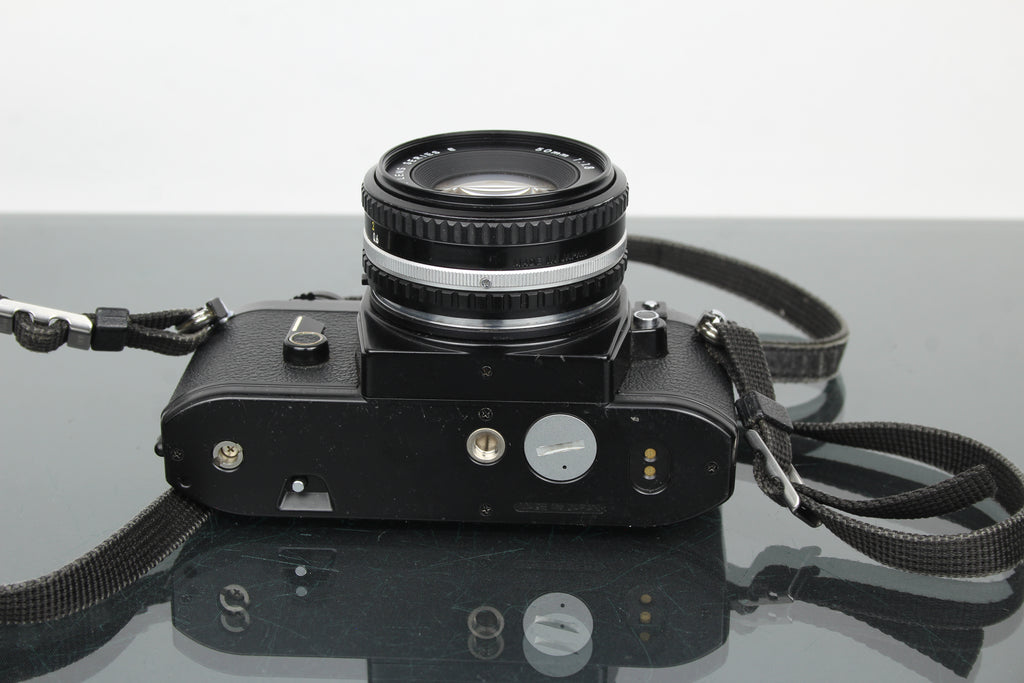 Nikon EM + lente de 50 mm 1:1.8 Serie E