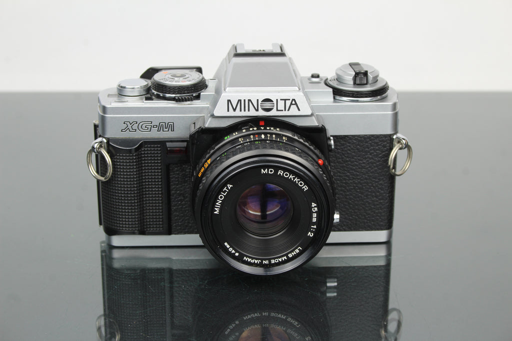 Minolta XG-M + lente Minolta MD Rokkor 45mm 1:2